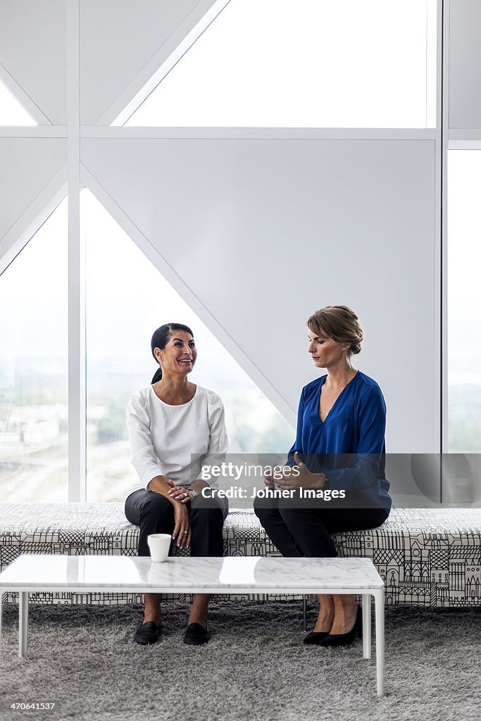 Two businesswomen talking