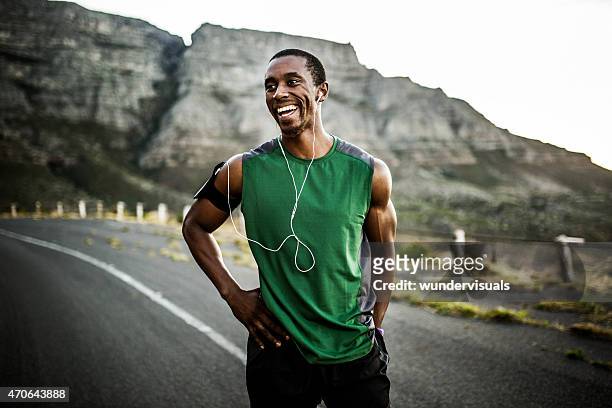 african athlete smiling positively after a good training session - sports training bildbanksfoton och bilder
