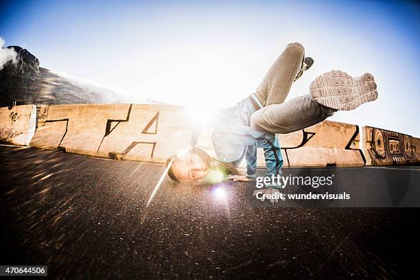 balancing strength and fitness for a teen girl breakdancer - modern dance bildbanksfoton och bilder