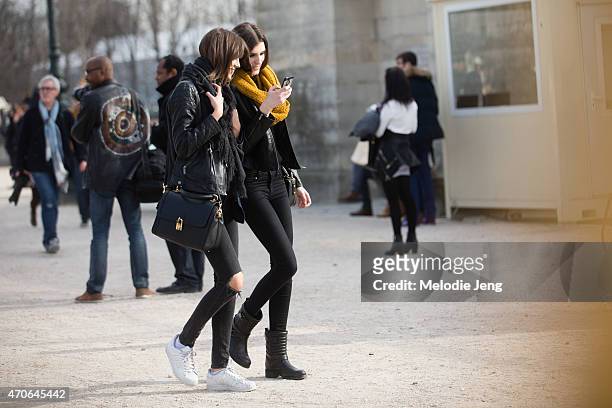Models Antonina Petkovic and Irina Djuranovic exit the Elie Saab show at the Tuileries on Day 5 of Paris Fashion Week PFW15 on March 7, 2015 in...