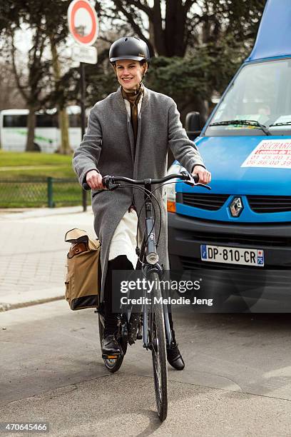 Model Saskia de Brauw exits the Mugler show by bike at Grand Palais on Day 5 of Paris Fashion Week PFW15 on March 7, 2015 in Paris, France.