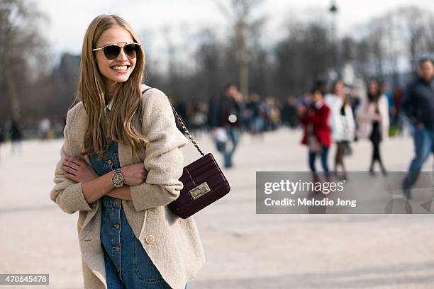 Model Sasha Luss exits the Elie Saab show at the Tuileries with an Elie Saab purse on Day 5 of Paris Fashion Week PFW15 on March 7, 2015 in Paris,...