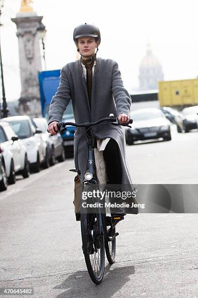 Model Saskia de Brauw exits the Mugler show by bike at Grand Palais on Day 5 of Paris Fashion Week PFW15 on March 7, 2015 in Paris, France.