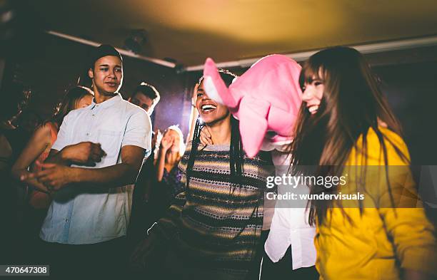 guy with a bunny head with friends at party - rabbit mask stock pictures, royalty-free photos & images