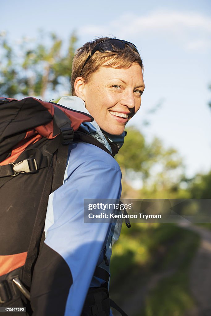Portrait of female hiker smiling outdoors