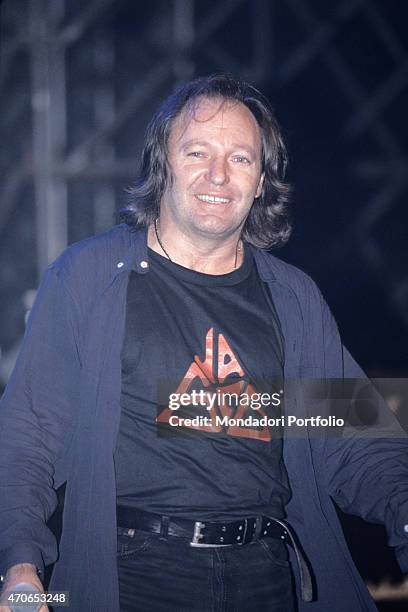 "The Italian rock singer Vasco Rossi is smiling during the rehearsals of the tour Nessun pericolo... Per te. Italy, 1996. "