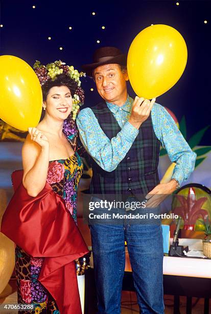 "Marisa Laurito and Renzo Arbore wearing multicoloured, eccentric garments on the set of the broadcast Marisa la Nuit, presented by the Neapolitan...