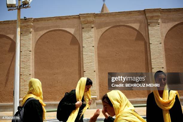 Iranian Armenian schoolgirls walk home after class in the Julfa neighbourhood in the historic city of Isfahan, some 400 kms south of the capital,...