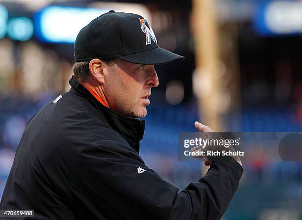 Manager Mike Redmond of the Miami Marlins signals to his players during a game against the Philadelphia Phillies at Citizens Bank Park on April 21,...