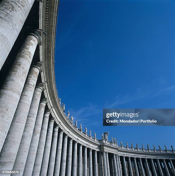 "Particular view from below of a part of the colonnade in St. Peter's Square; designed and built by the architect Bernini, it is composed of 284...