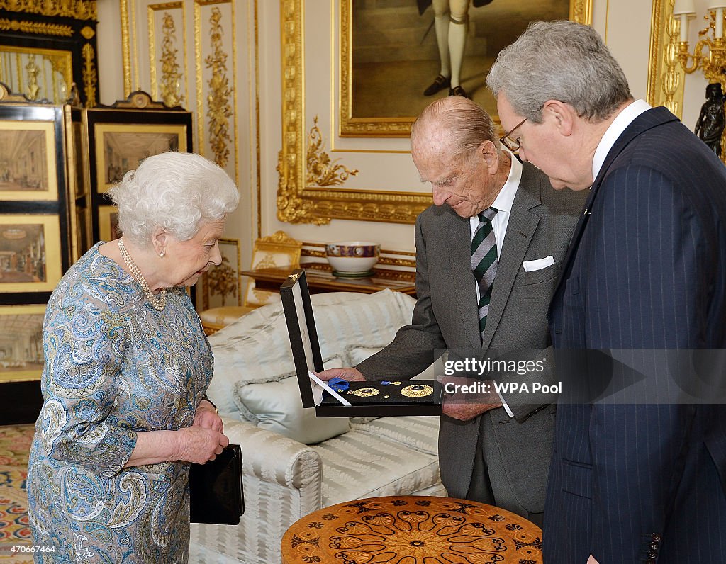 Queen Elizabeth II Presents The Insignia of A Knight of the Order of Australia To Prince Philip, Duke of Edinburgh