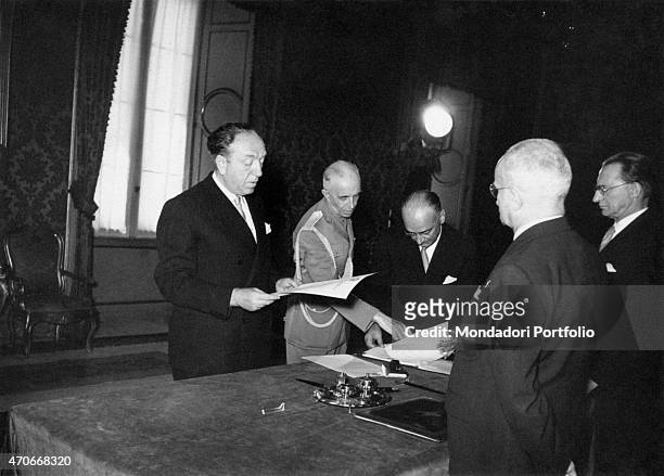 Ezio Vanoni taking an oath in honour of the 7th De Gasperi Cabinet, where he will fulfill the role of Minister of Economy and Finance; in front of...