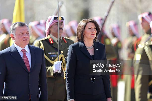 King Abdullah II of Jordan and President of the Republic of Kosovo Atifete Jahjaga review the royal honour guard at the royal offices on February 20,...