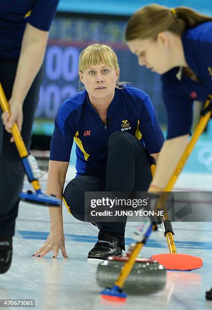 Sweden's Maria Prytz watches the stone during the Women's Curling Gold Medal Game Sweden vs Canada at the Ice Cube Curling Center during the Sochi...