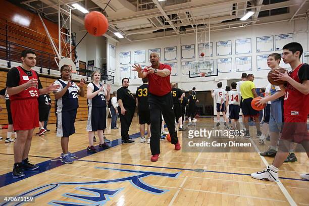 Milwaukee Bucks assistant coach Scott Williams interacts with participants during a Special Olympics basketball skills clinic on February 11, 2014 at...