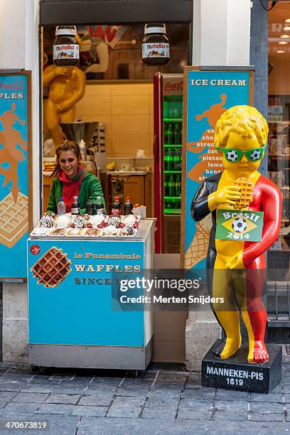 belgium waffle shop with manneke pis - manneke pis stock pictures, royalty-free photos & images