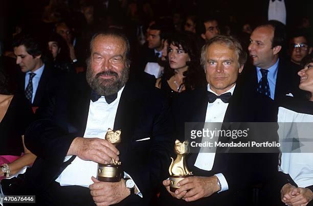 "Italian actor, director, scriptwriter and TV producer Terence Hill and Italian actor, scriptwriter and film producer Bud Spencer showing the...