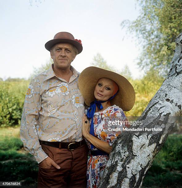 "Portrait of Italian actor and TV host Raimondo Vianello and his wife and Italian actress Sandra Mondaini wearing big straw hats. They present...