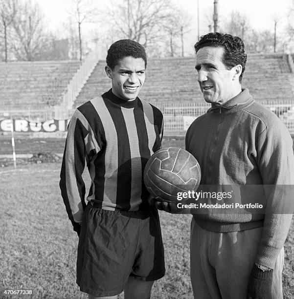 "Brazilian football player Jair de Costa wearing the Inter suit and posing beside Argentinian football player and coach of the Inter team Helenio...