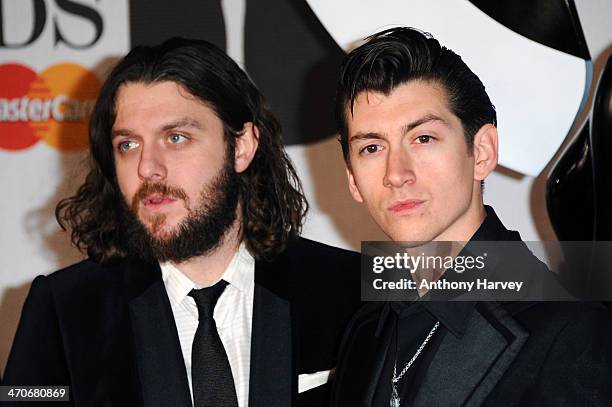 Nick O'Malley and singer Alex Turner of Arctic Monkeys attend The BRIT Awards 2014 at 02 Arena on February 19, 2014 in London, England.