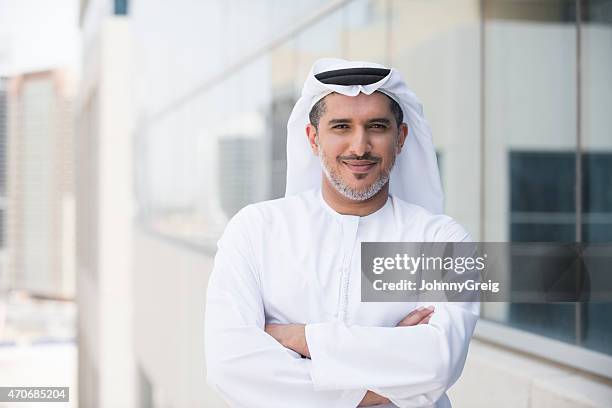 arab businessman portrait outside office building - förenade arabemiraten bildbanksfoton och bilder