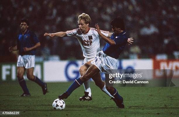 Fernando De Napoli of Italy takes the ball past Oleksiy Mykhailychenko of USSR during the UEFA European Championships 1988 Semi-Finals match between...