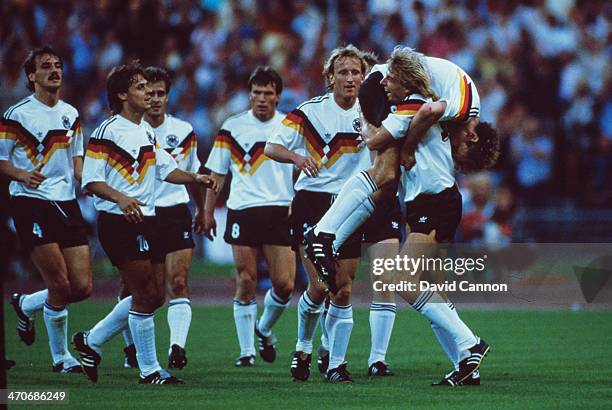 Rudi Voller of West Germany celebrates with team-mates after scoring his first goal of the match during the UEFA European Championships 1988 Group 1...
