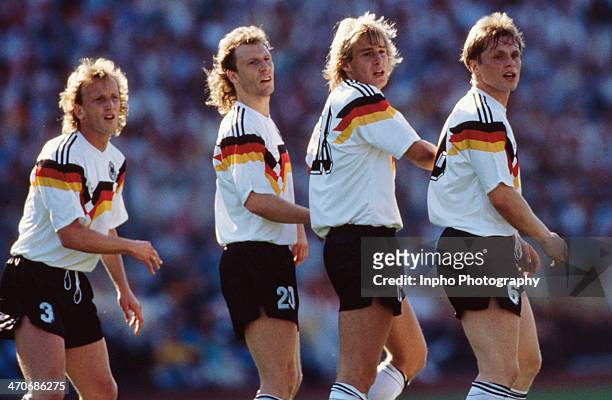 West Germany players Andreas Brehme, Wolfgang Rolff, Jurgen Klinsmann and Ulrich Borowka line up to defend a free kick during the UEFA European...