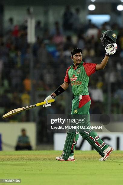 Bangladesh cricketer Soumya Sarkar reacts after scoring a century during the third One Day International cricket match between Bangladesh and...