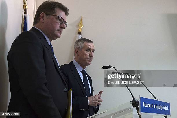 Paris Prosecutor Francois Molins , flanked by French Christian Sainte , head of French criminal police, speaks during a press conference at the Paris...