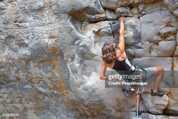 determined to reach the top - woman cliff stock pictures, royalty-free photos & images