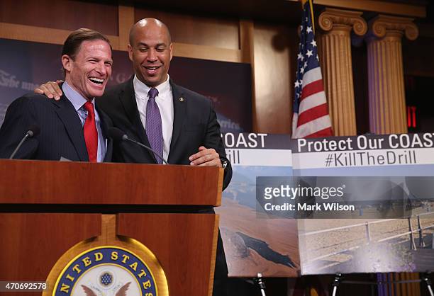 Sen. Richard Blumenthal , and U.S. Sen.Cory Booker , share a laugh during a news conference on drilling for oil in the Atlantic Ocean April 22, 2015...