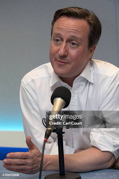 Prime Minister David Cameron speaks as he is interviewed by Bauer City Network presenter Angie Greaves during a visit to the Bauer Radio studios on...