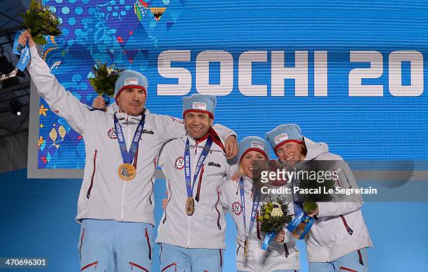 Gold medalists Emil Hegle Svendsen, Ole Einar Bjoerndalen, Tiril Eckhoff and Tora Berger of Norway celebrate during the medal ceremony for the 2 x 6...