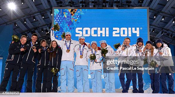 Bronze medalists Lukas Hofer, Dominik Windisch, Karin Oberhofer and Dorothea Wierer of Italy, gold medalists Emil Hegle Svendsen, Ole Einar...