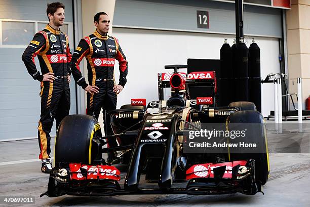 Pastor Maldonado of Venezuela and Lotus and Romain Grosjean of France and Lotus stand with the new Lotus E22 following day two of Formula One Winter...