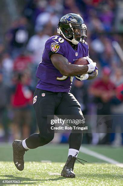 Bernard Pierce of the Baltimore Ravens runs the ball during the game against the Cincinnati Bengals at M&T Bank Stadium on November 10, 2013 in...