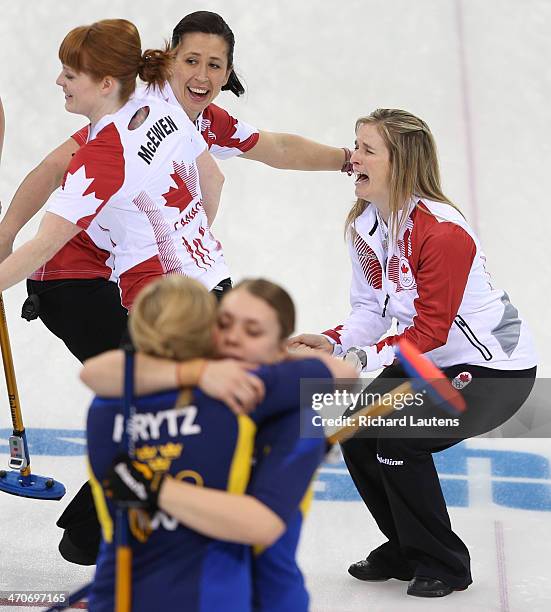 Sochi, Russia - February 20 - SSOLY- Canadian skip Jennifer Jones screams with Jill Officer and Dawn McEwen beside her as Swedes, Maria Wennerstroem...