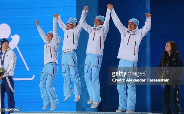 Gold medalists Tora Berger, Tiril Eckhoff, Ole Einar Bjoerndalen and Emil Hegle Svendsen of Norway celebrate during the medal ceremony for the 2 x 6...