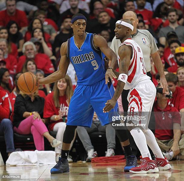 Rajon Rondo of the Dallas Mavericks looks for a teammate as he is guarded by Jason Terry of the Houston Rockets during Game Two of the Western...