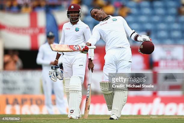 Marlon Samuels of West Indies celebrates reaching his century alongside Denesh Ramdin during day two of the 2nd Test match between West Indies and...