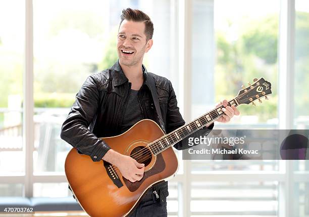 Singer-Songwriter Andy Grammer gives a surprise performance at a cancer center in LA in partnership with Ford Warriors in Pink at Providence Saint...