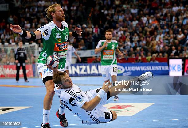 Steffen Weinhold of Kiel challenges for the ball with Manuel Spaeth of Goeppingen during the DKB HBL Bundesliga match between THW Kiel and Frisch Auf...