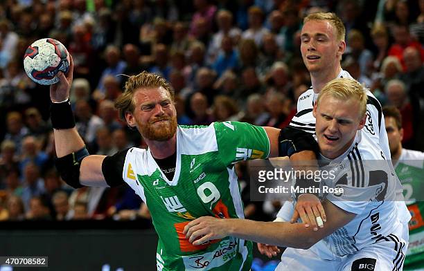 Patrick Wiencek of Kiel challenges for the ball with Manuel Spaeth of Goeppingen during the DKB HBL Bundesliga match between THW Kiel and Frisch Auf...