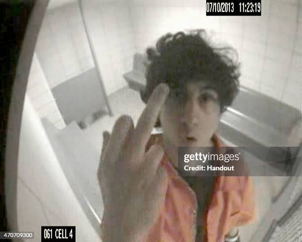 In this handout image of security footage provided by the United States Attorneys Office, Boston Marathon bomber Dzhokhar Tsarnaev is seen giving the...