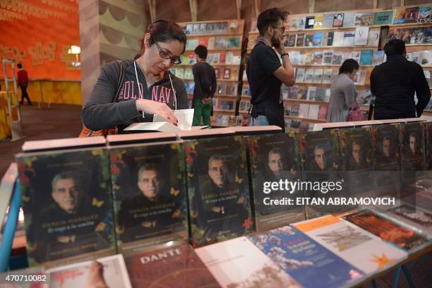 Visitor leafs through a book in a pavilion dedicated to Macondo, the fictitious town in which many of late Colombian Nobel laurate Gabriel Garcia...