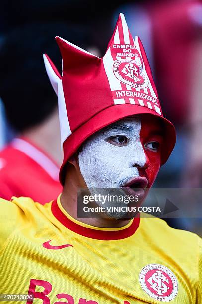 Supporters of Brazil's Internacional cheer for their team during the Copa Libertadores 2015 football match against Bolivia's The Strongest at Beira...