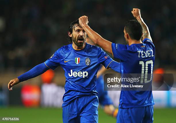 Andrea Pirlo and Carlos Tevez of Juventus celebrate at the final whistle during the UEFA Champions League quarter-final second leg match between AS...