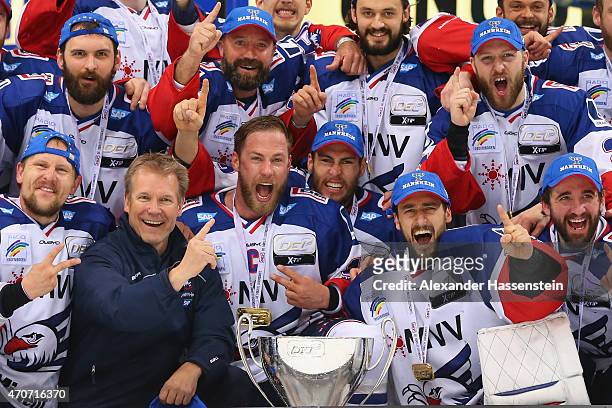 The team of Mannheim celebrates winning the German Championship title after winning the DEL Play-offs Final Game 6 between ERC Ingolstadt and Adler...