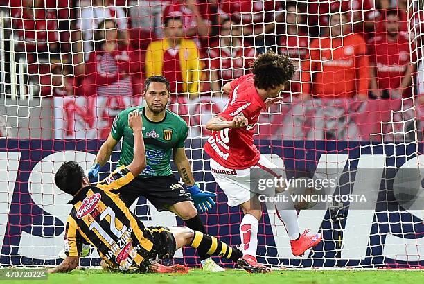 Valdivia of Brazil's Internacional shoots over Jair Torrico Bolivia's The Strongest as goalie Daniel Vaca looks on during the Copa Libertadores 2015...